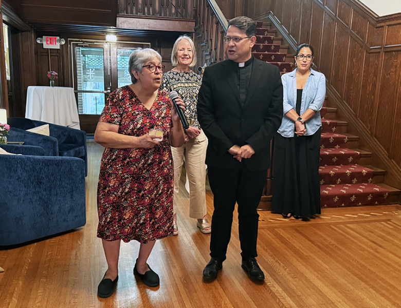 Maria Quintero addressing guests at her retirement party after 49 years at UST
