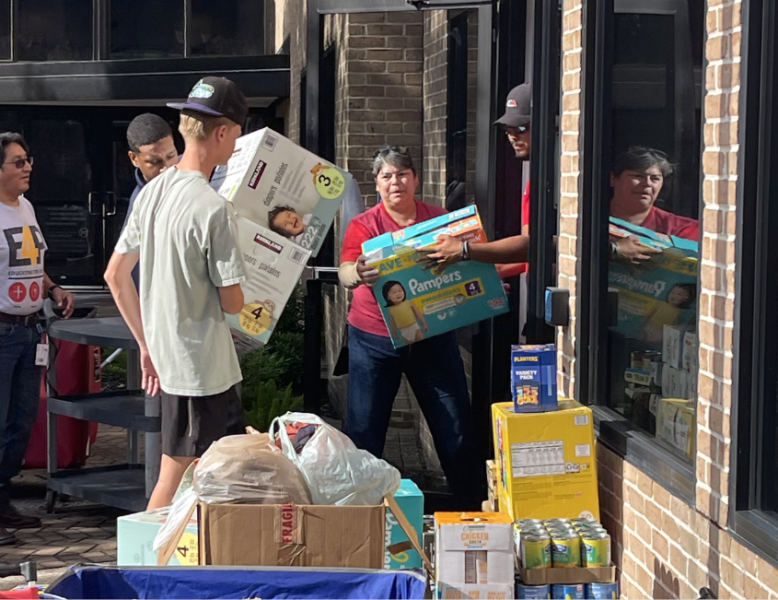 UST volunteers helping to load up donations