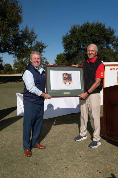 Joe Cleary, Jr. presented with a framed Celt Classic pin flag by Dr. Robert Ivany.