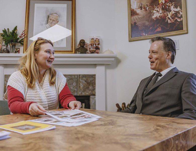 Executive Director Dr. John Corrigan talks with Administrative Assistant Emilia Piechota.