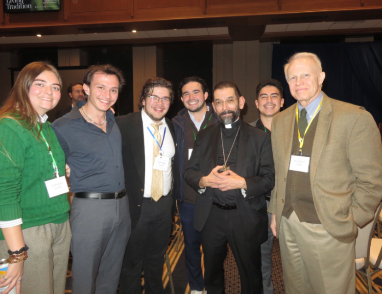 UST student pose with UST Alumnus Bishop Daniel Flores and UST Professor Dr. Randy Smith at the fall conference.