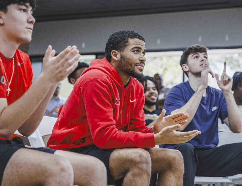 UST Men's Basketball enjoys a team watch party for the NCAA DIII bracket reveal.