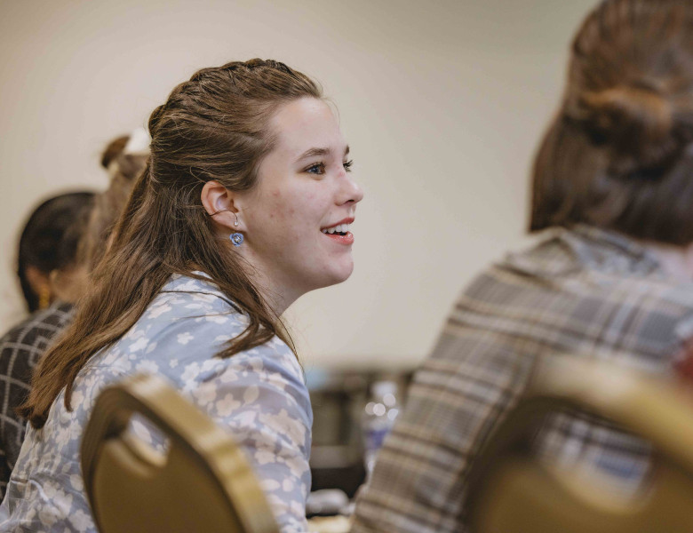 An Honors student enjoys the conversation with Sean Tracey and Andrew Troxler.