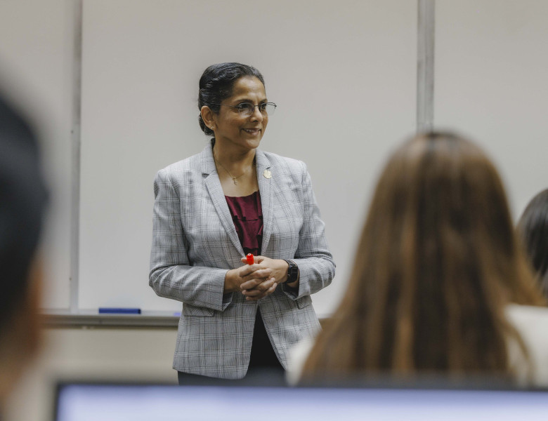 Dr. Beena George teaches a course in the Cameron School of Business.